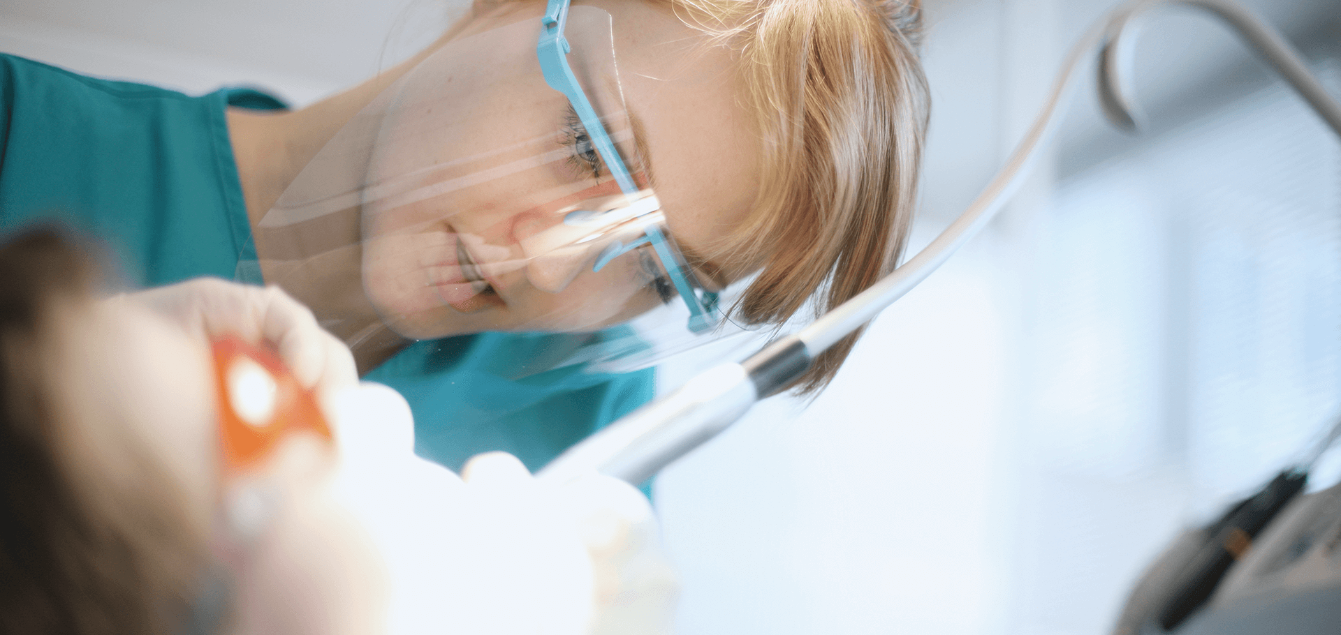 Dentist performing root canal surgery on patient