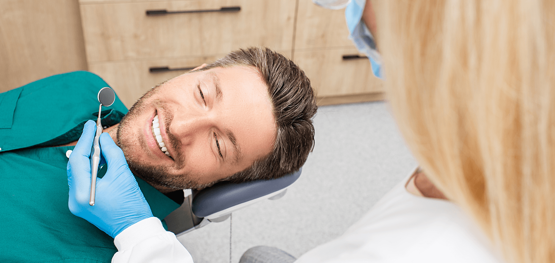 Patient checking out his new dental veneers