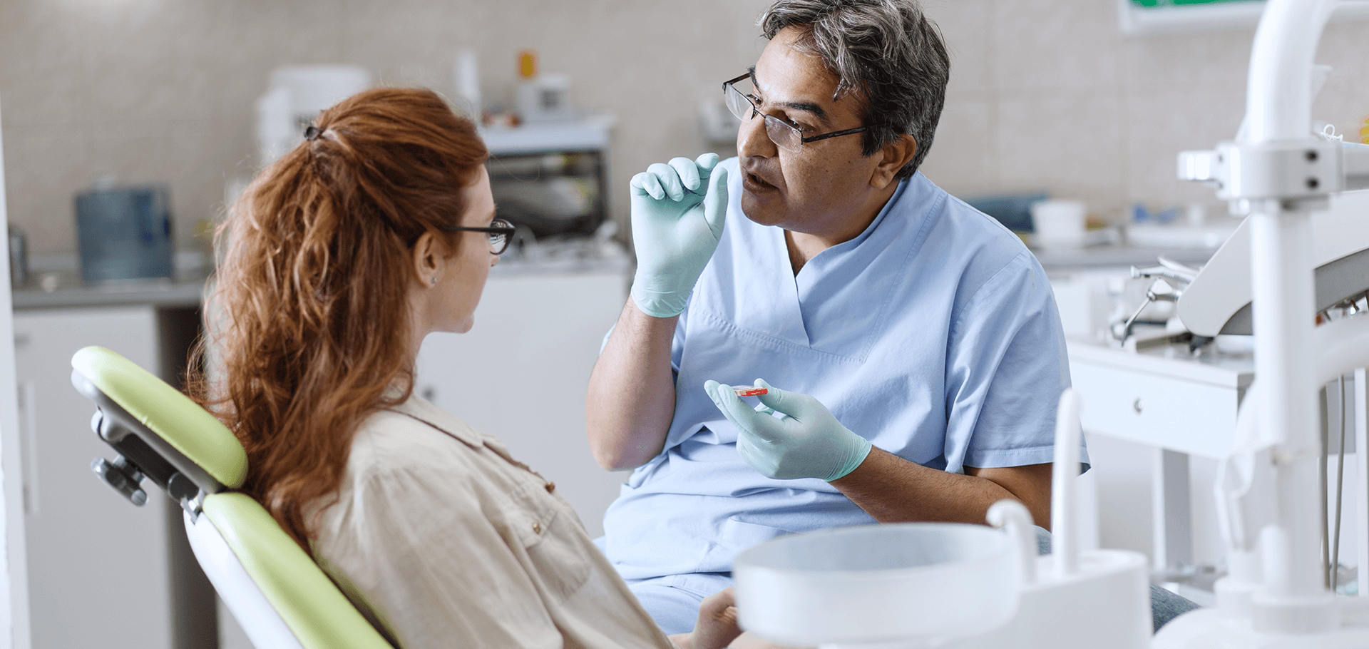 Dentist explaining a procedure to a patient