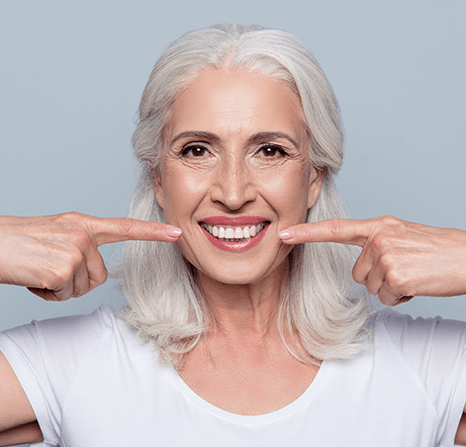 An older woman showing off her smile