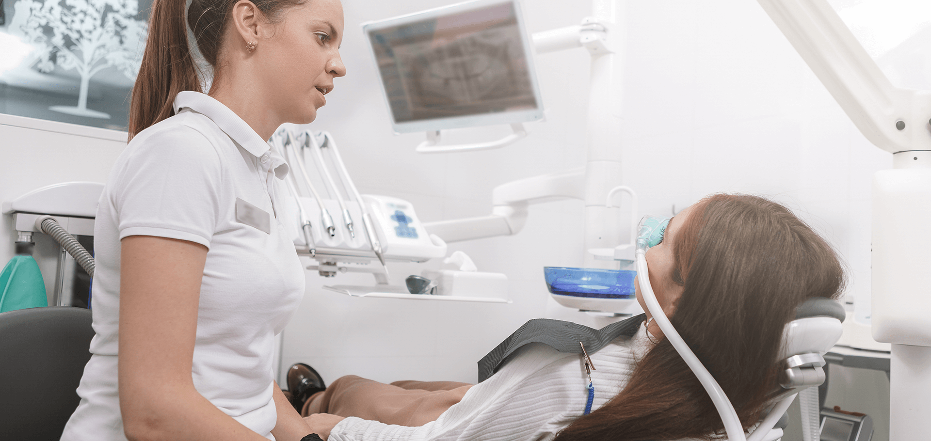 Patient sedated on a dental chair