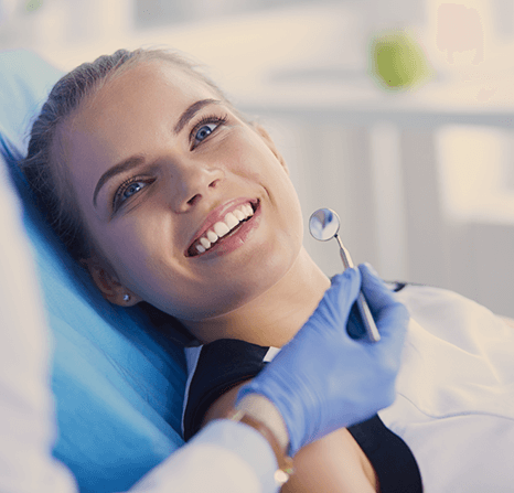A patient looking a her teeth